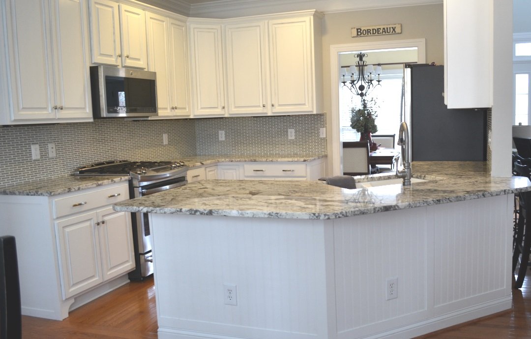 White painted kitchen cabinets and island